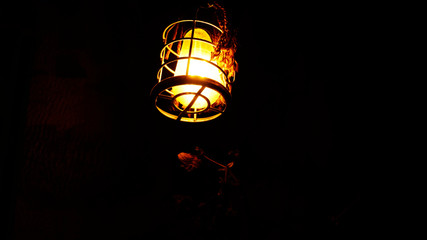 old school light bulb in dark