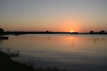Naklejka na ściany i meble Sunset over the lake