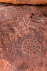Petroglyphs carved into stone in Arches National Park.