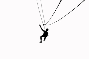 Silhouette men are playing zip line on white background.