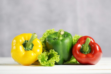 Sweet pepper on white wooden table.