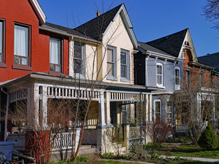 Row of old Victorian style brick houses with gables