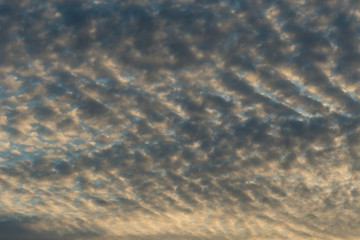 background texture of blue sky near dusk with heavy cloud in some pattern