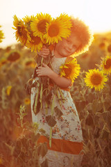 Child in sunflowers