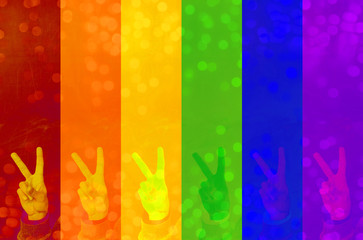 Fototapeta na wymiar LGBT gesture freedom on colorful blurred background with natural bokeh light balls. abstract symbol backdrop - Image