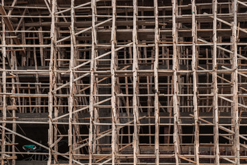 Facade covered with wooden scaffolding
