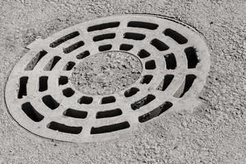 Dirty round sewer manhole cover