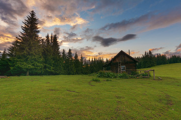 Journey through the mountain ranges and tops of the Ukrainian Carpathians, a tourist with a tent in a beautiful summer weather with fantastic sunrises and sunsets.