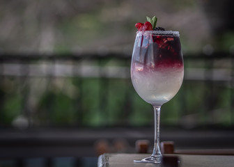 glass of wine on table in garden
