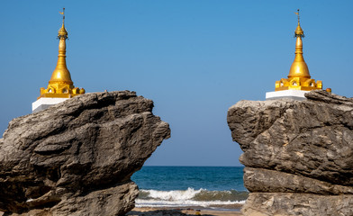 Buddhist stupas at Ngwe Saung Beach on the Bay of Bengal in western Myanmar