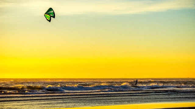 Kitesurfing Kiteboarding at Pacific Ocean Oregon Coast Sunset