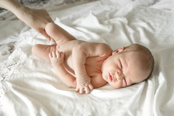 Newborn naked Baby girl on white background