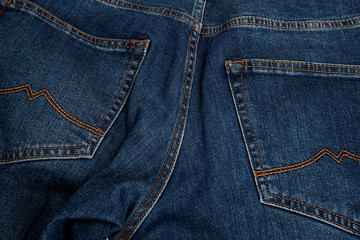 Fototapeta premium Fashionable clothes. Jeans on a background.