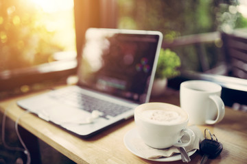  Laptop and cappuccino in the coffee shop