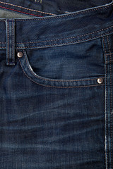 Fashionable clothes.  Jeans on a  background.