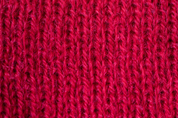 Knitted texture close-up, visible threads and fibers. The image is suitable as a background for various tasks.