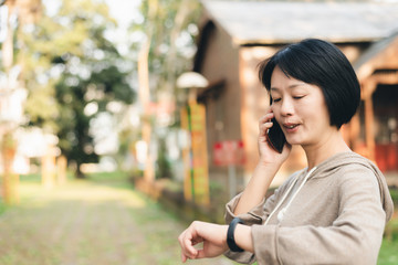 talk on cellphone and using smart watch