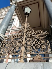 ensemble metal fence with patterns and street lamp        