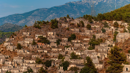 Fototapeta na wymiar View of abandoned houses at village Kayakoy near Fethiye, Turkey, selective focus