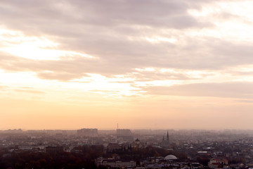 sunset over a big city from a high mountain