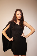 Fototapeta premium Beautiful brunette girl posing for photo at the studio