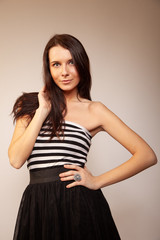 Beautiful brunette girl posing for photo at the studio