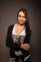 Beautiful brunette girl posing for photo at the studio