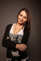 Beautiful brunette girl posing for photo at the studio