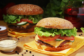 Two fresh hamburgers with vegetables