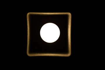 symmetry lamp in the box, light like a moon at night, isolated in dark background
