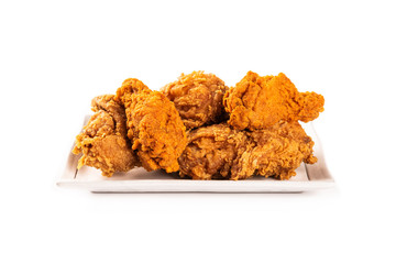 Fried chicken on white plate isolated on white background.