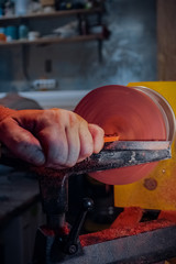 Carpenter working on a lathe close-up. Wood processing