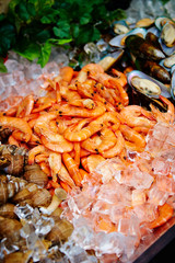 Seafood buffet, shrimps and seashells