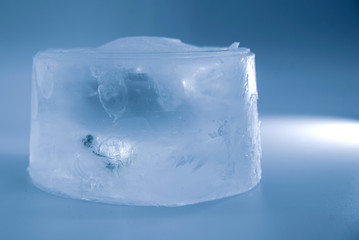 A piece of ice on a blue background.