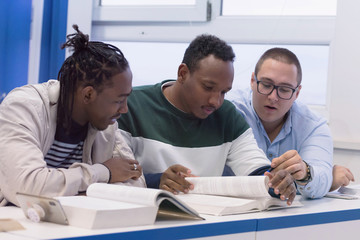 Fototapeta premium University mixed race Students, african, american and european during the class. Resolving problems together. Team work, multiethnic and happyness concept .