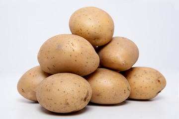 Fototapeta na wymiar Potatoes on the white background.