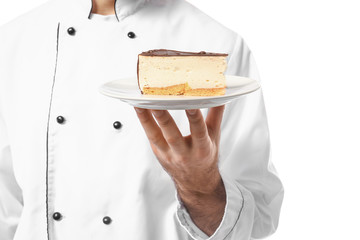 Male confectioner with tasty dessert on white background, closeup