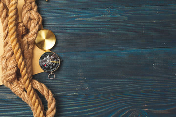 Nautical background. Sailing rope with a compass
