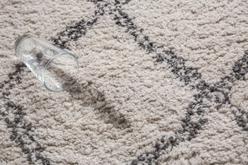Glass of water spilled on carpet