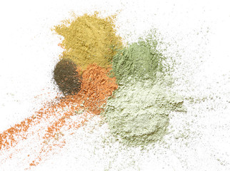 Cosmetic clays on white background