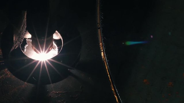 Close-up Top View Of The Laser Head Cuts A Metal Sheet