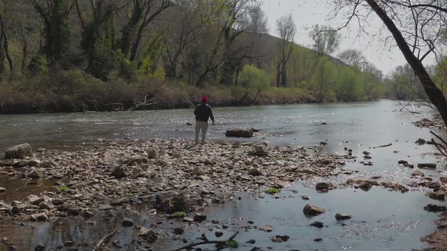 Fisherman fishing at the river 2.