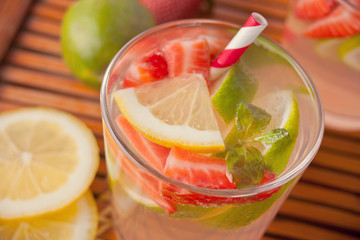 Strawberry Lemonade or mojito cocktail with lemon and mint, cold refreshing drink or beverage