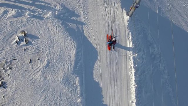 People walking of the lift in a ski resort in Norway.