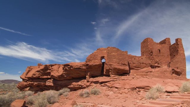 A wide shot approaching the ruins of the Wukoki pueblo at Wupatki National Monument in Arizona.