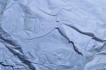 Texture of crumpled recycled brown paper. Moonlight.