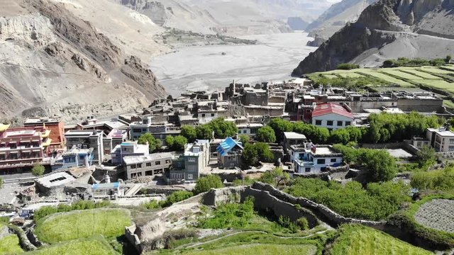 Aerial view of Kagbeni and the mountain valley in the Himalayas. Old houses and agricultural fields. Upper Mustang. Nepal.
