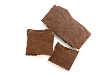 pieces of porous chocolate on a white background, isolate 