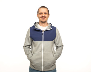 Fototapeta premium Man in hoodie standing at white background