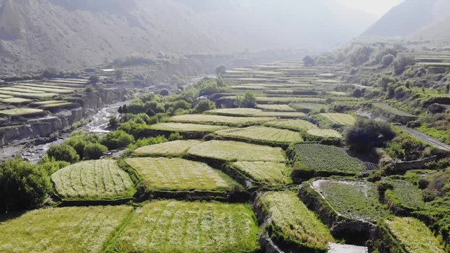 Aerial view of mountain valley in the Himalayas. Agricultural fields along the river. This is a track around Annapurna. Upper Mustang. Nepal.